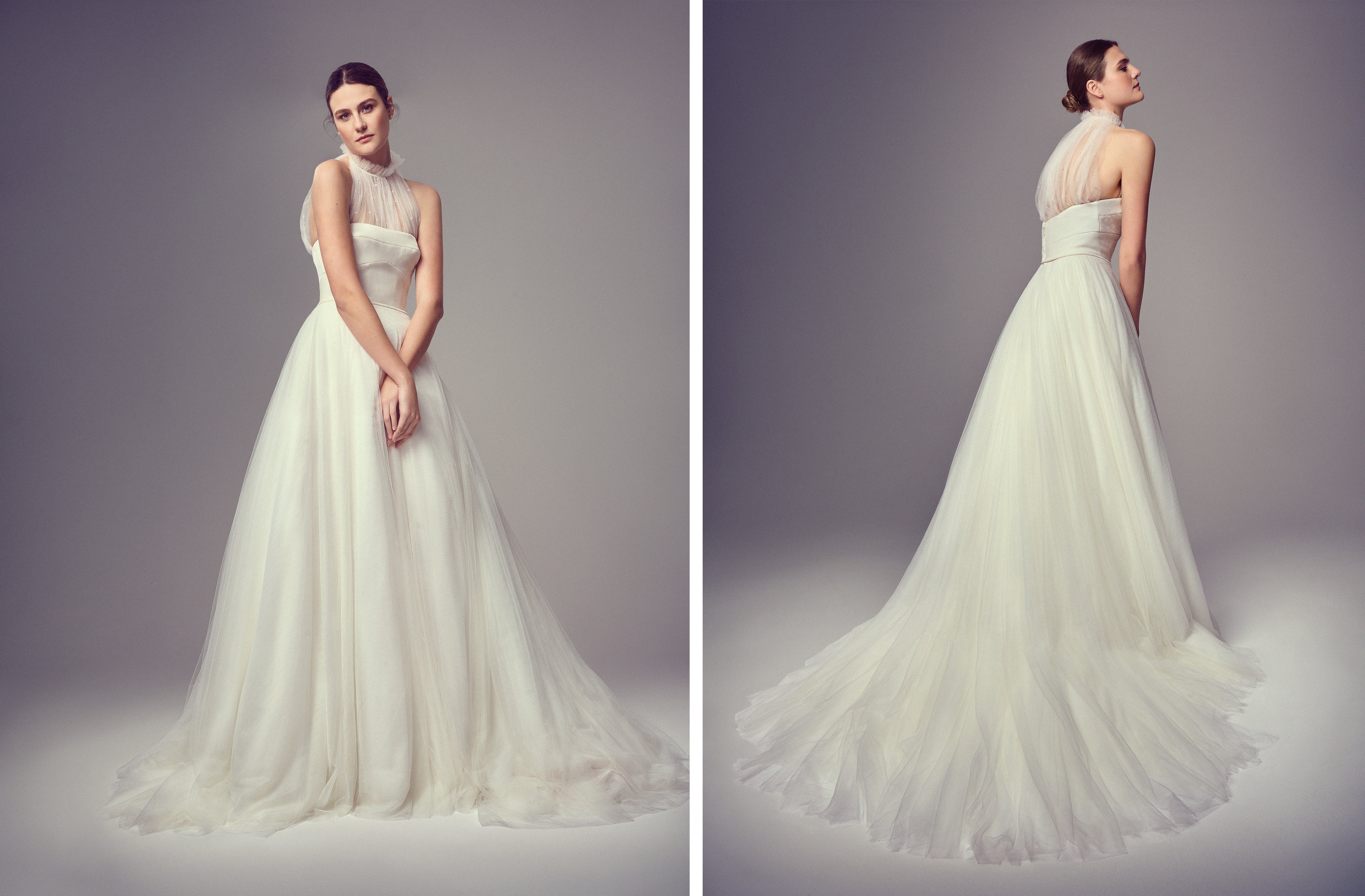 Model in a strapless gown with a tulle halter neckline and voluminous layered skirt extending into a soft, flowing train.
